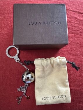 NWOT Louis Vuitton Silver Mirror Ball Keychain with Cream Dust Bag and Box